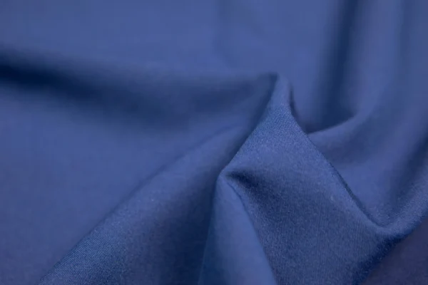 A close up of the fabric in blue