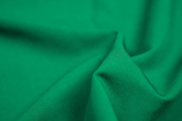 A close up of the fabric in green