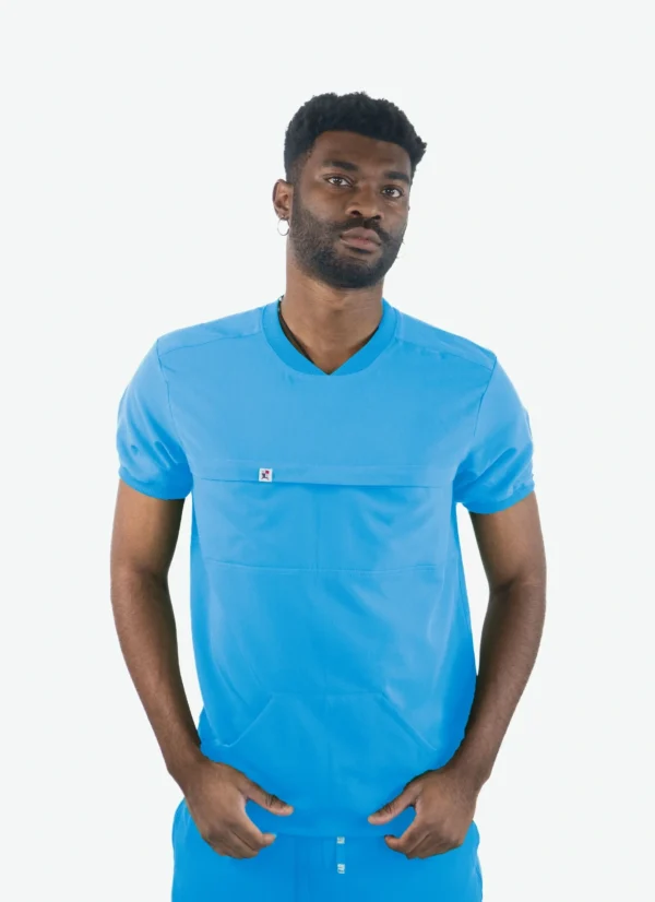 A man wearing a blue shirt with pockets.